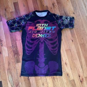 10th planet rash guard